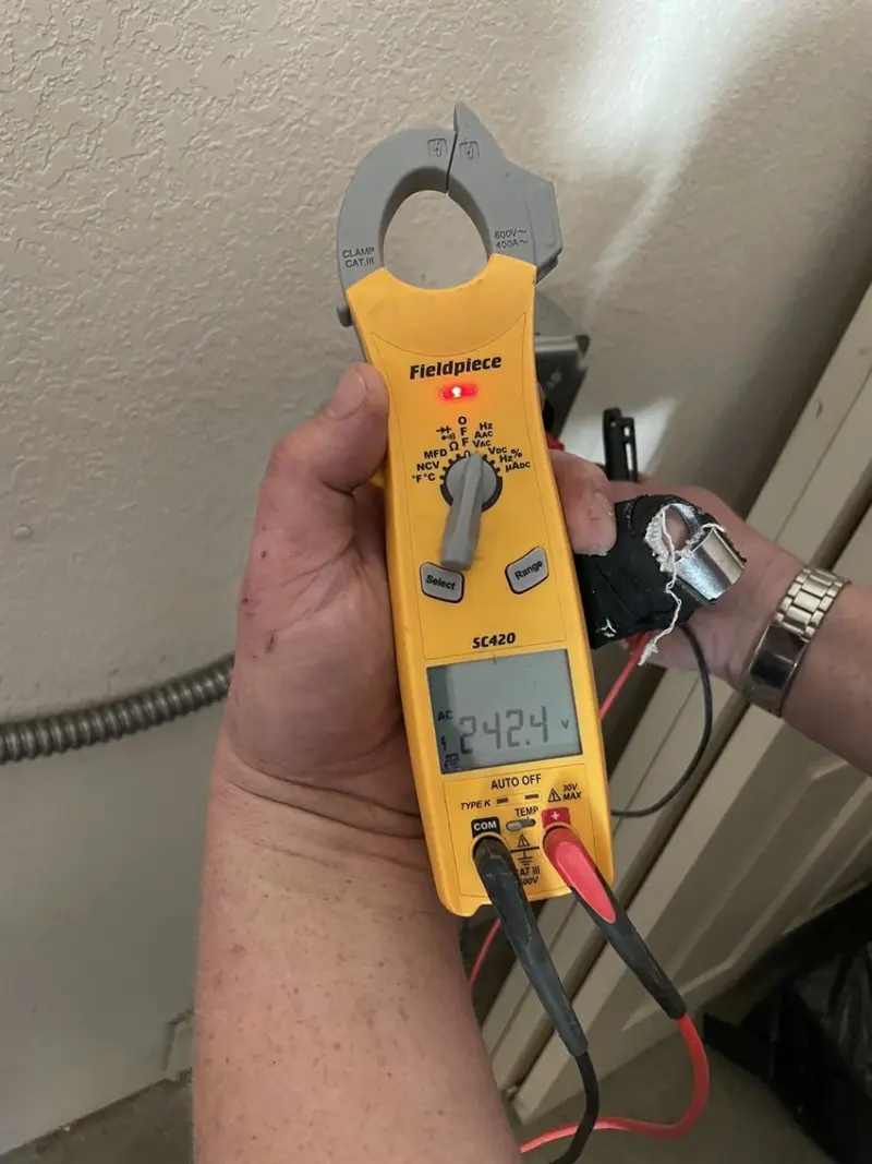 Voltage testing with clamp meter during Whole House Surge Protector in Granite Falls